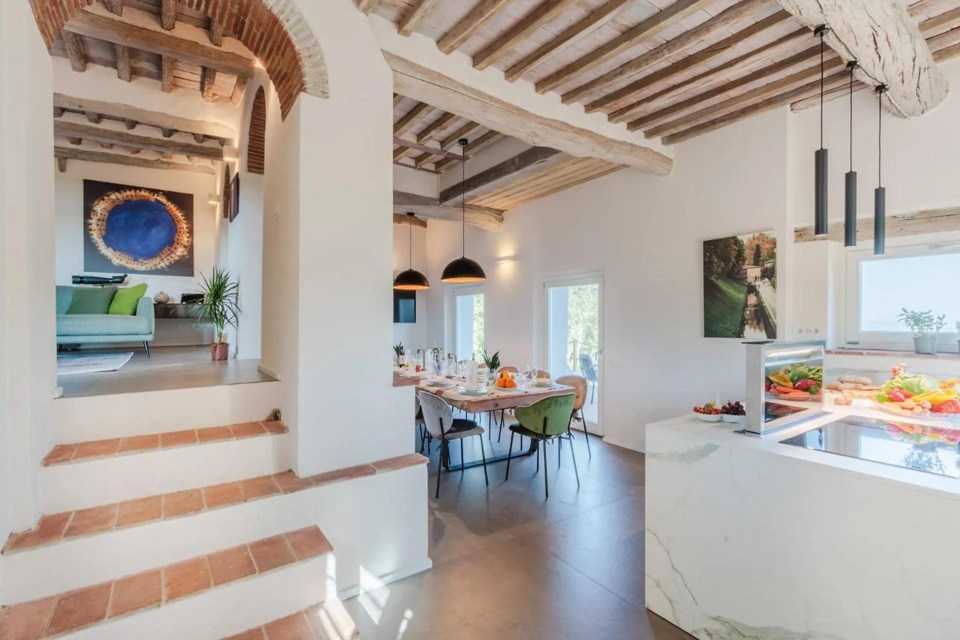The kitchen at Villa Gioma with the island and the dining room