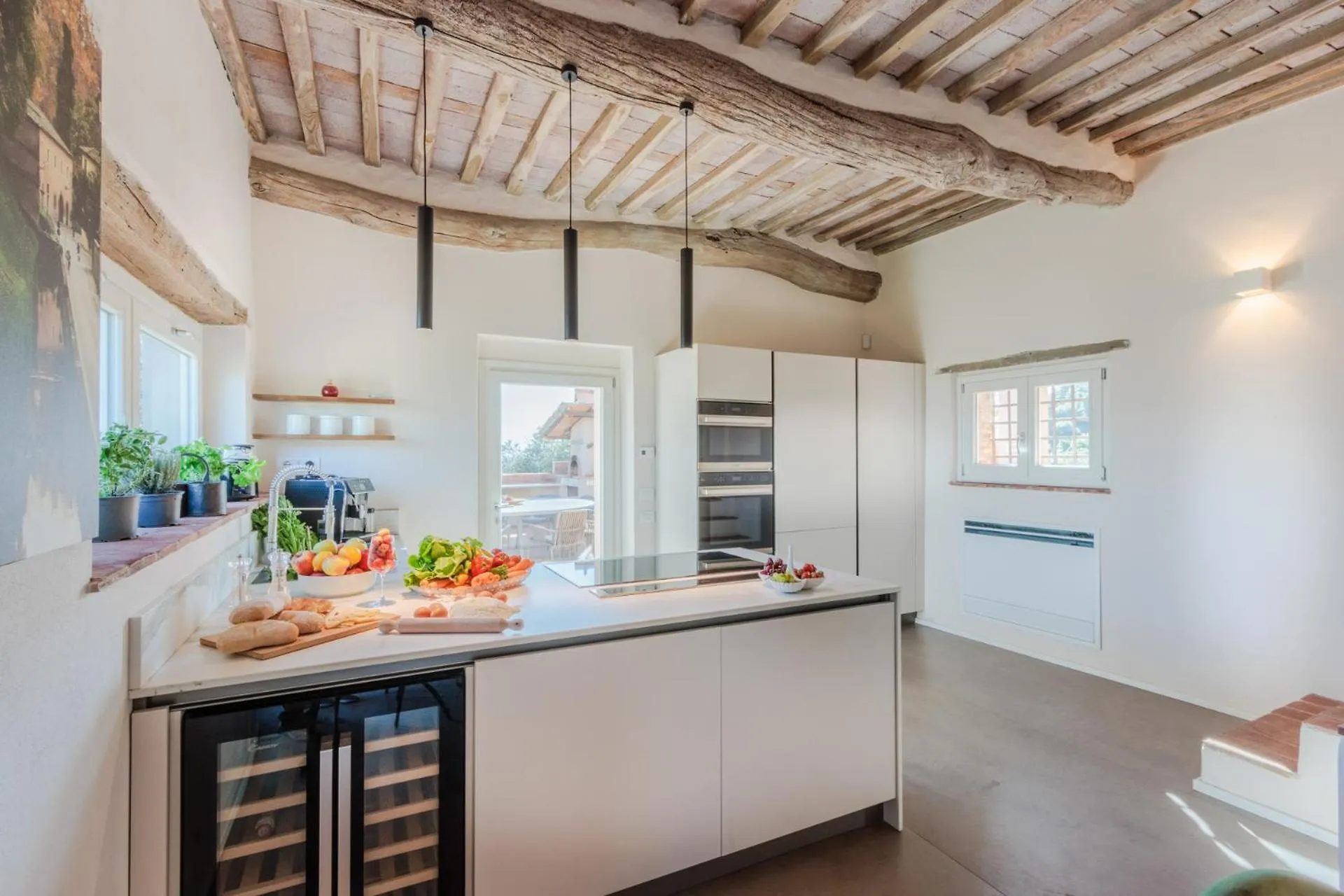 The kitchen at Villa Gioma with the island and the dining room