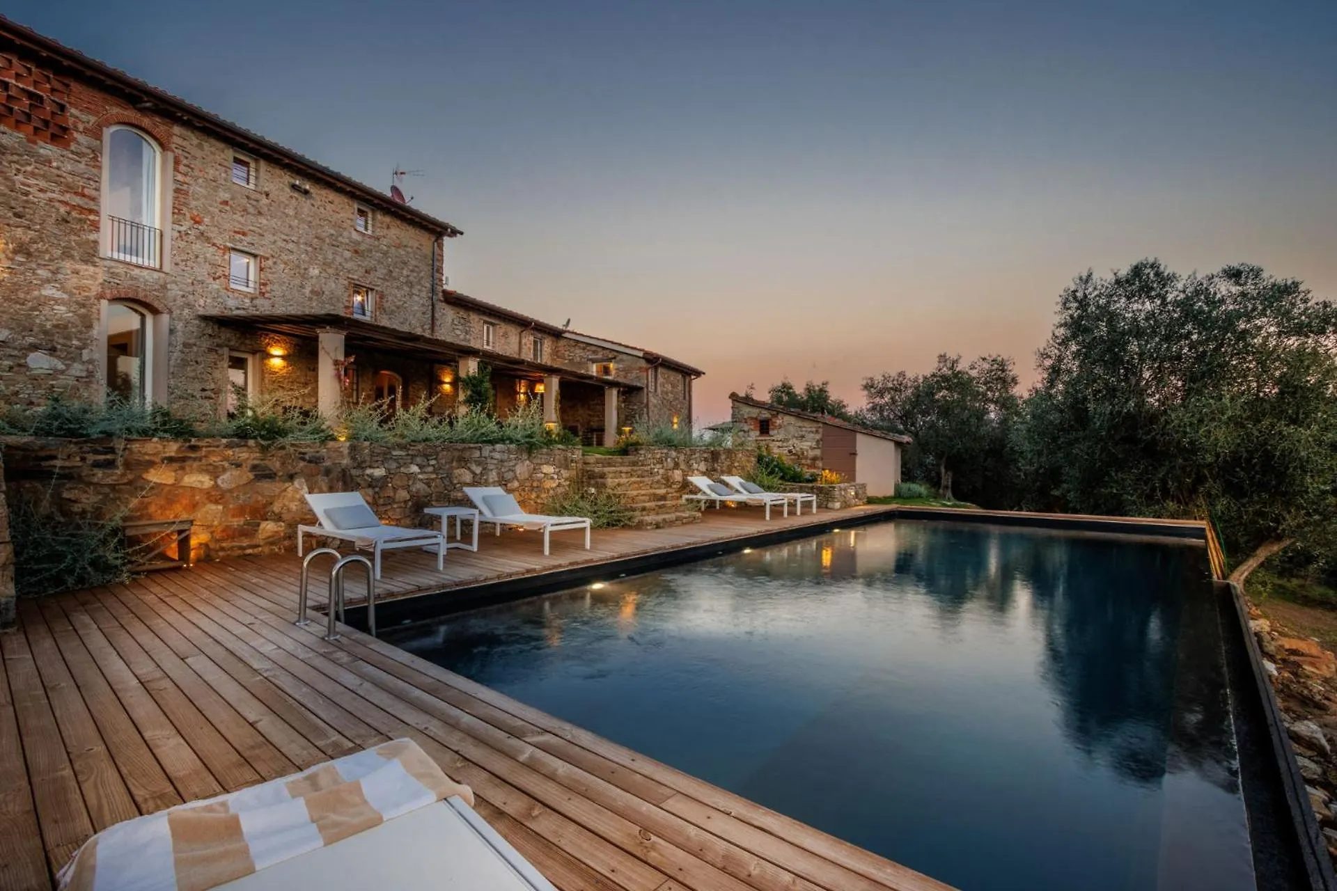 The infinity pool at Villa Gioma with the view over the hills at sunset