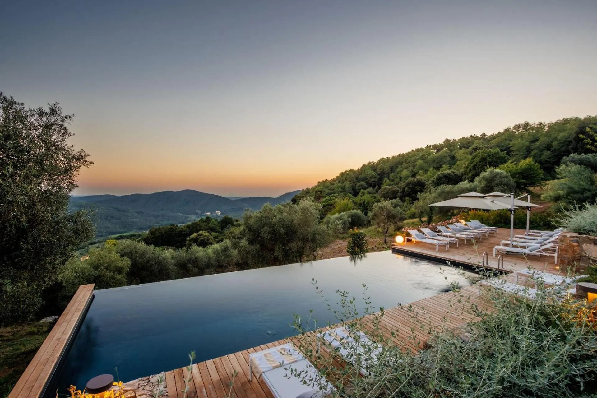 The infinity pool at Villa Gioma with the view over the hills at sunset