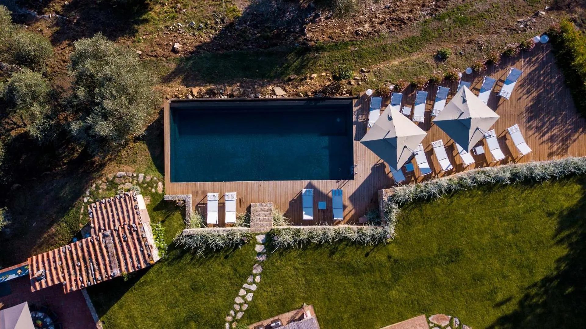 The infinity pool at Villa Gioma with the view over the hills at sunset